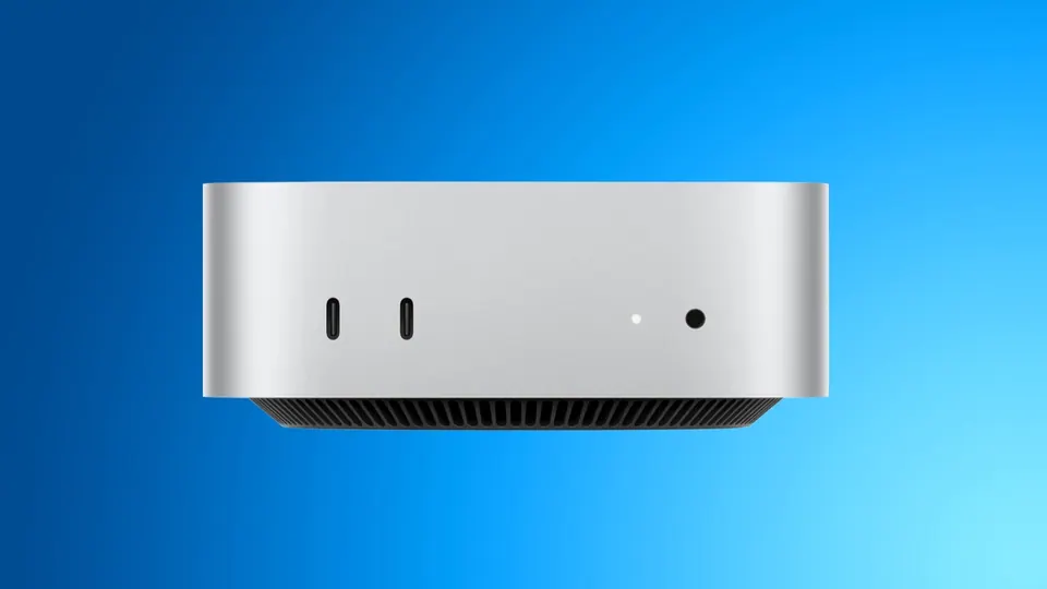 Mac mini màu bạc thiết kế 5 x 5 inch trên nền xanh